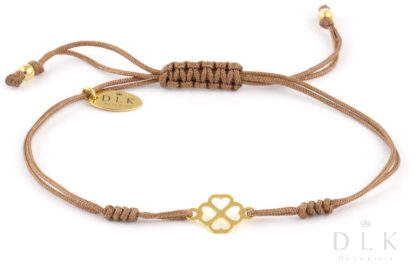 Bracelet “Beige string with a golden clover in hearts”