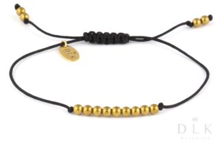 Bracelet “Golden hematite balls on a black string”