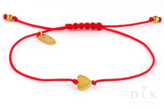 Bracelet “Golden hematite heart on a red string”
