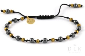 Bracelet “Black and gold hematites on a black string”