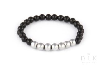 Elastic ring made of onyx with a strap of silver hematite