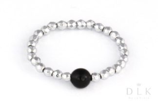 Flexible ring made of silver hematite with an onyx ball