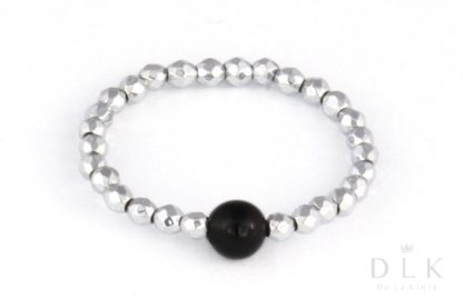 Flexible ring made of silver hematite with an onyx ball