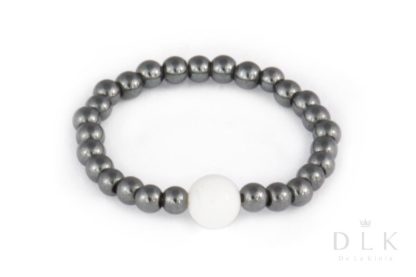 Flexible dark hematite ring with a white jade ball