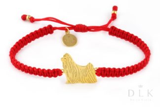 Bracelet with yorkshire terrier golden on a red macrame