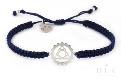 Bracelet with a silver throat chakra on a navy blue macrame