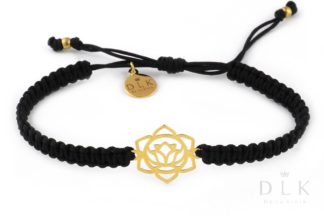Bracelet with a golden sacral chakra on a black macrame