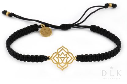 Bracelet with a gold base chakra on a black macrame