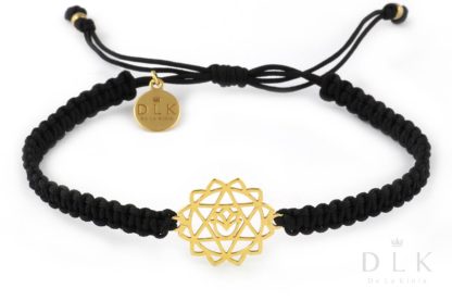 Bracelet with golden heart chakra on black macrame