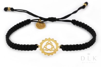 Bracelet with a gold throat chakra on a black macrame