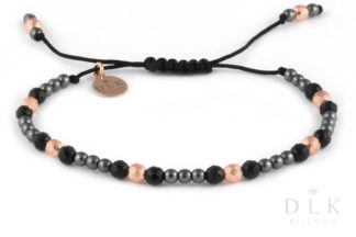 Bracelet with pink and black hematites with onyx balls on a black string