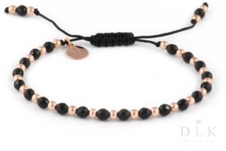Bracelet with onyx and pink hematites on a black string