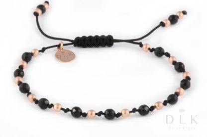 Bracelet with onyx with pink hematites on a black string