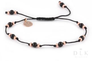Bracelet with onyx balls and pink hematites on a black string