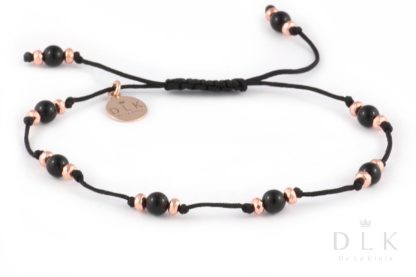 Bracelet with onyx balls and pink hematites on a black string