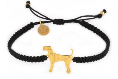 Bracelet with airedale terrier golden on a black macrame