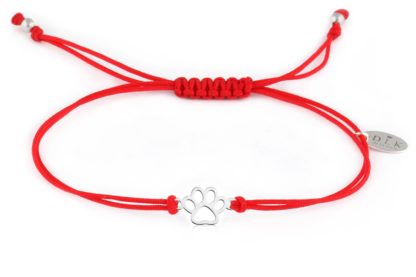 Bracelet with silver dog paw on a red string