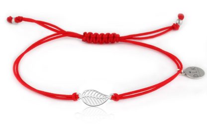Bracelet with silver leaf on a red string
