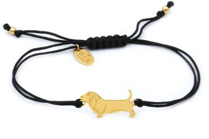 Bracelet with basset golden on a black string
