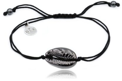 A bracelet with a silver and black Kauri shell on a black string